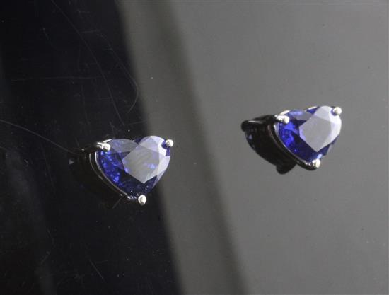 An attractive pair of 18ct white gold and heart shaped sapphire ear studs,